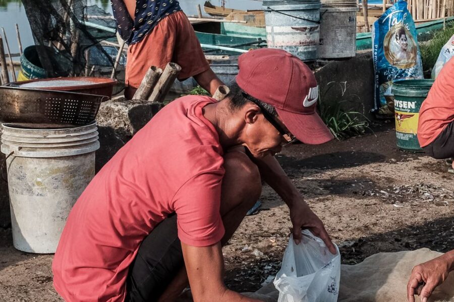 Fishermen in Brgy. 1, Ibaba del Sur, in Wawa Park can be seen weighing the "dulong," or silver fish, caught per kilo before taking it to the public market on Tuesday morning, May 16, 2023, in Paete Laguna.