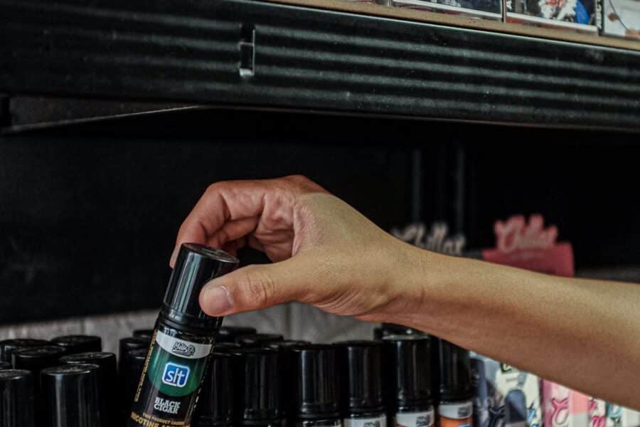 A salesperson fixed their vape juice products at Vito Cruz in Pasay City on Wednesday, May 17, 2023. The Department of Trade and Industry (DTI) closely monitors online sellers of vape products. DTI undersecretary Ruth Castelo said the department is monitoring online sellers to track down those selling illegal vape products.