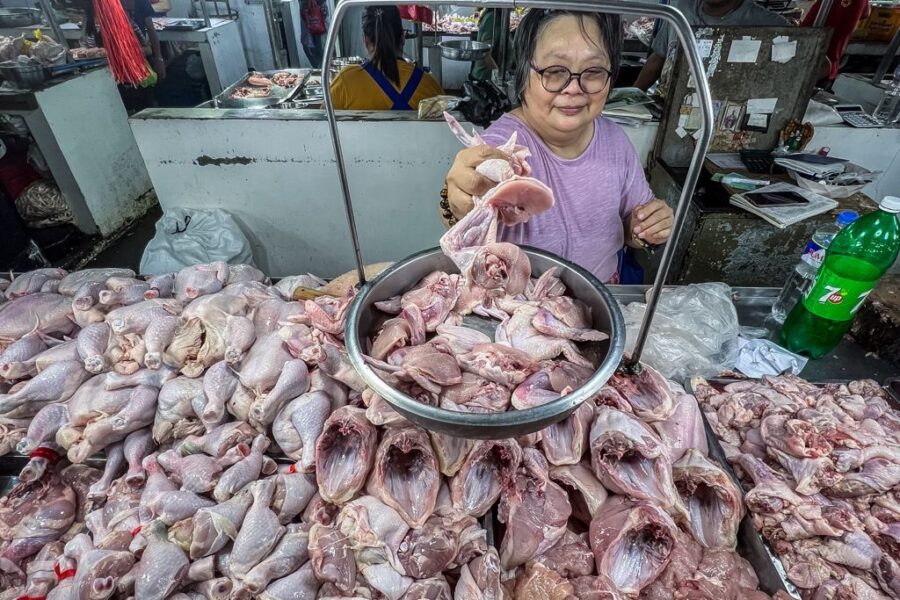 A chicken vendor in Paco Market arranges the chicken products on Thursday, May 18, 2023 in MetroManil. A group of poultry farmers, Philippine Rural Reconstruction Movement (PRRM), Samahang Industriya ng Agrikultura (SINAG), and United Broiler Raisers Association (UBRA) is calling on the government to implement a moratorium on the importation of chicken meat.
