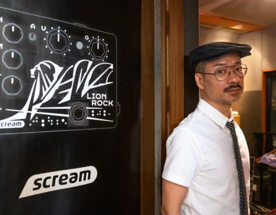 Brian Leung, host of radio programme "We Are Family,'' poses for a photograph at his office in Hong Kong on July 29, 2023. A radio show promoting LGBTQ equality will end its 17-year run at Hong Kong's public broadcaster on July 29, with station management citing "changes in programme" as the reason for cancellation. The axing of "We Are Family" comes after Beijing crushed Hong Kong's democracy movement and imposed a sweeping national security law in 2020, which critics say has fractured civil society and silenced dissent. (Photo by Bertha Wang / AFP)