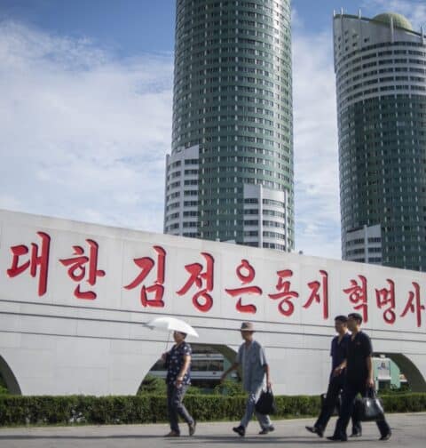 People walk along Ryomyong Street in Pyongyang, North Korea, on August 8, 2023. (Photo by Kim Won Jin / AFP)