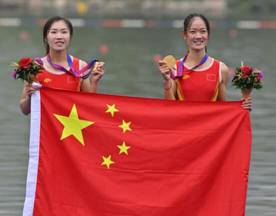 Gold medallists China's Zou Jiaqi and Qiu Xiuping pose for a photo during a medal ceremony after the women's light-weight double sculls final event of rowing during the 2022 Asian Games in Hangzhou in China's eastern Zhejiang province on September 24, 2023. (Photo by JUNG YEON-JE / AFP)