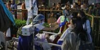 Residents and medical personnel evacuate patients from inside a hospital after a 7.4 magnitude earthquake struck Butuan City, in southern island of Mindanao late December 2, 2023. (Photo by AFP)