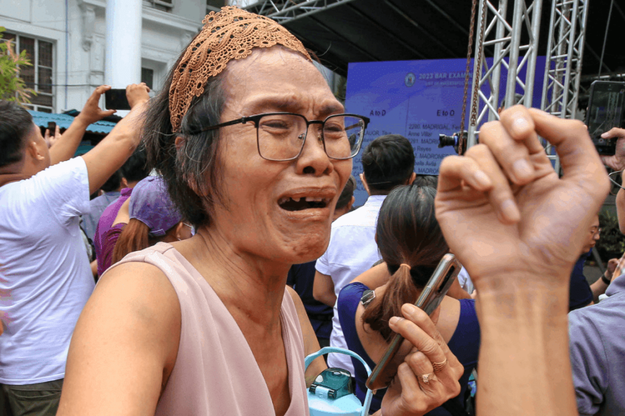 The announcement of the 2023 Bar Exam results in Manila on Tuesday, December 5, 2023, elicited various emotions among exam takers and their parents. The University of Santo Tomas (UST) secured the fifth position with an 85.25% passing rate, while the University of the Philippines (UP) followed closely with an 89.45% passing rate. The University of San Carlos (USC) claimed the third spot, achieving a 90.91% passing rate, trailed by San Beda University with a 92.20% passing rate. Ateneo de Manila University (ADMU) emerged as the top law school, boasting a remarkable 94.08% passing rate. Photo by Ryan Baldemor