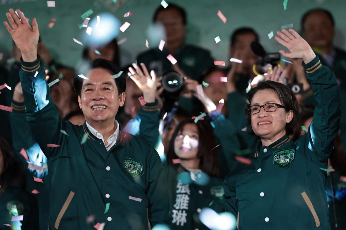 Taiwan's President-elect Lai Ching-te (L) and his running mate Hsiao Bi-khim attend a rally outside the headquarters of the Democratic Progressive Party (DPP) in Taipei on January 13, 2024, after winning the presidential election. - Taiwan's ruling party candidate Lai Ching-te, branded a threat to peace by China, on January 13 won the island's presidential election, a vote watched closely from Beijing to Washington. (Photo by Yasuyoshi CHIBA / AFP)